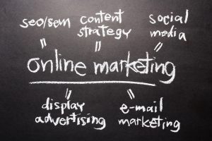 Handwriting on chalkboard of Online Marketing concept